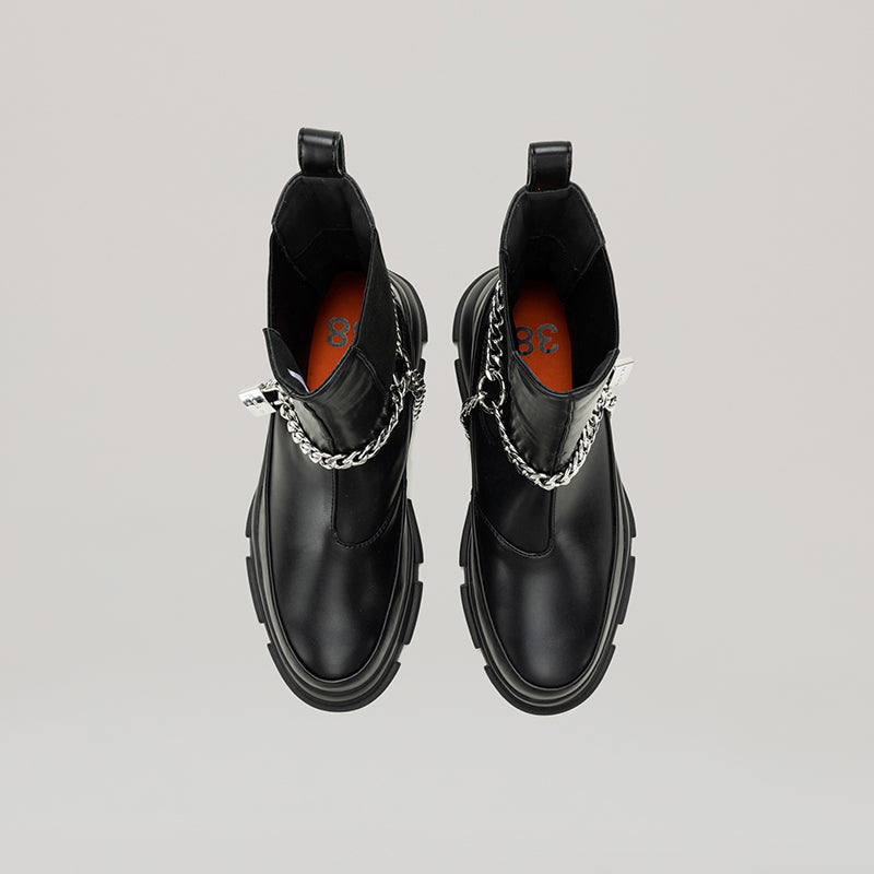 Black GAO EVA HIGH CHELSEA boots with detachable padlock ankle chain made of PU pleather and calf leather