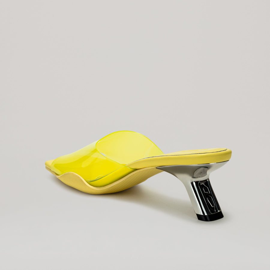 Yellow 40MM kitten heeled PVC mules with semi-transparent upper and diagonal metal heel