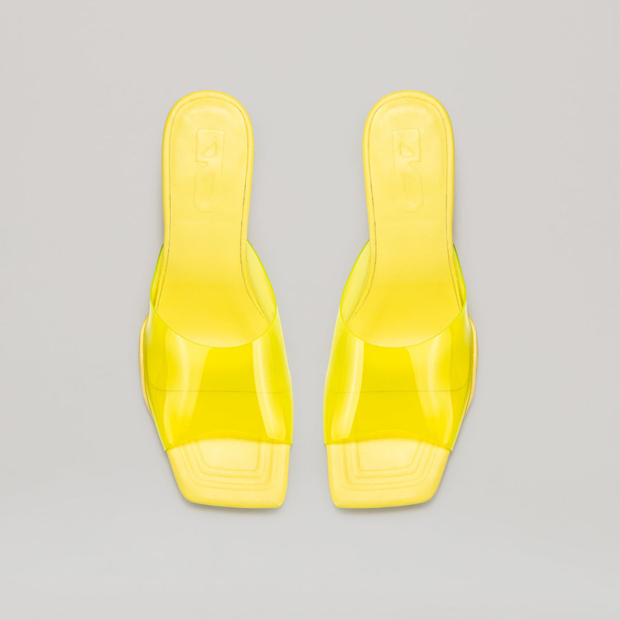 Yellow 40MM kitten heeled PVC mules with semi-transparent upper and metal heel