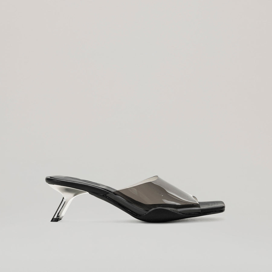 both - 40MM KITTEN HEELED PVC black mules with semi-transparent upper and diagonal metal heel