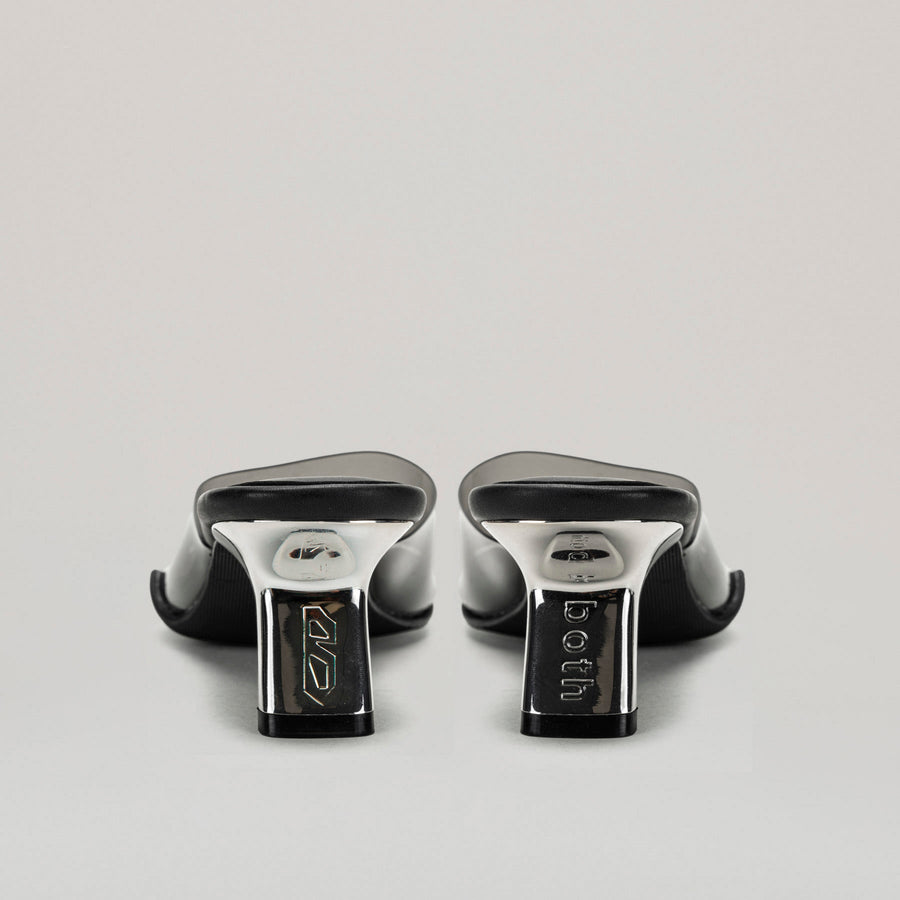 both - 40MM KITTEN HEELED PVC mules in black with semi-transparent upper and diagonal metal heel