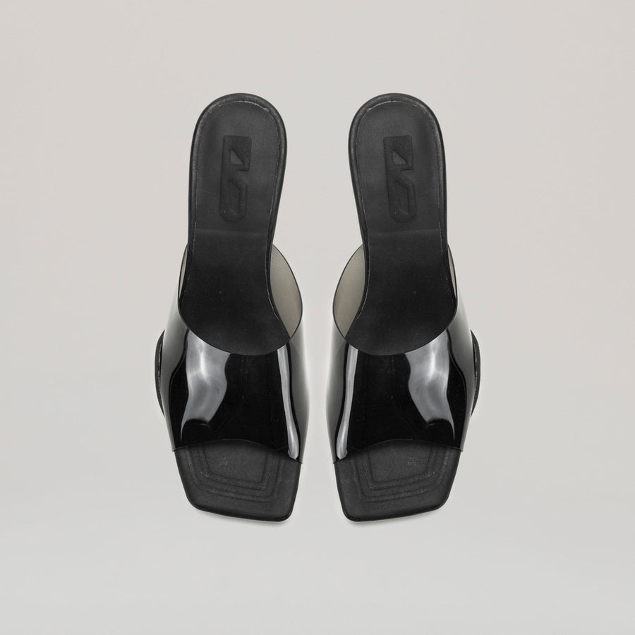 both 40MM kitten heeled black PVC mules with semi-transparent upper and diagonal metal heel