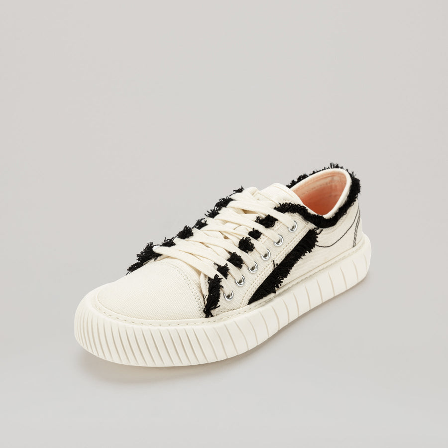White FORMULA LOW sneaker with black fringe hem and EVA rubber sole