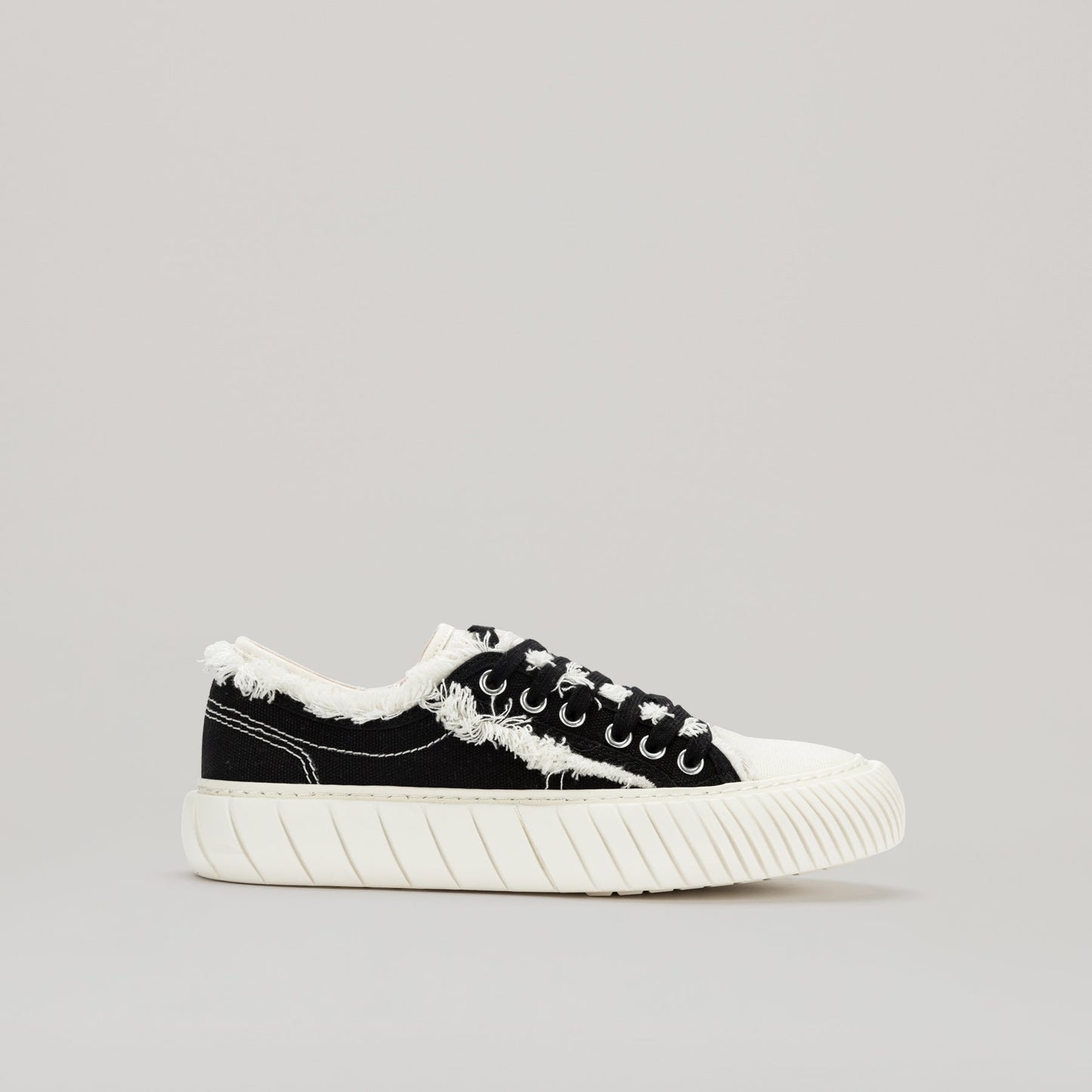 both - FORMULA LOW black canvas sneaker with white fringe hem and durable EVA rubber sole