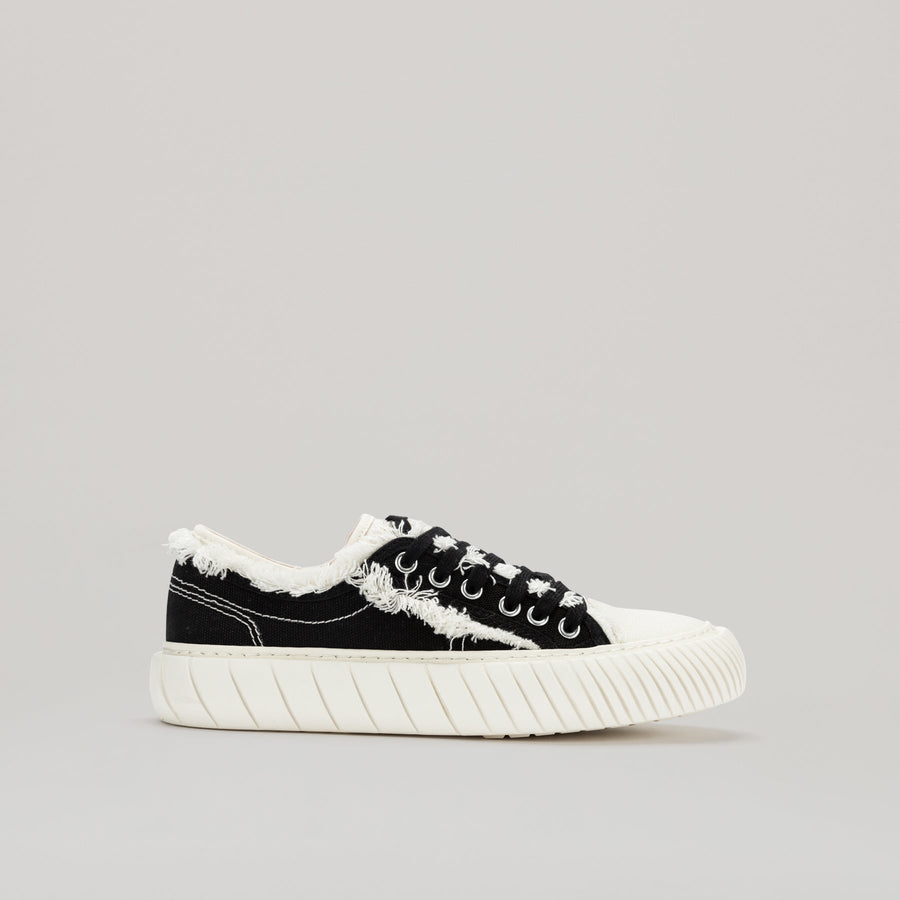 both - FORMULA LOW black canvas sneaker with white fringe hem and durable EVA rubber sole