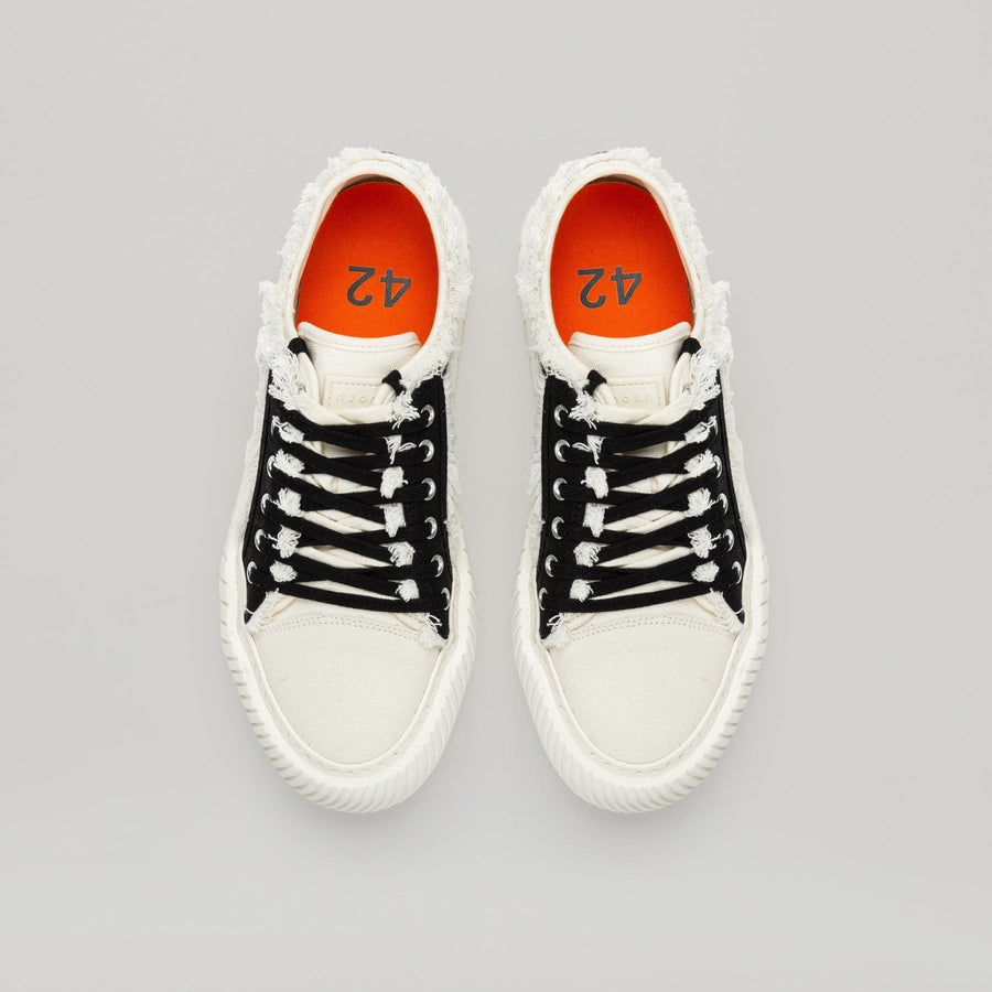 both - FORMULA LOW black canvas sneaker with white fringe hem and durable sole