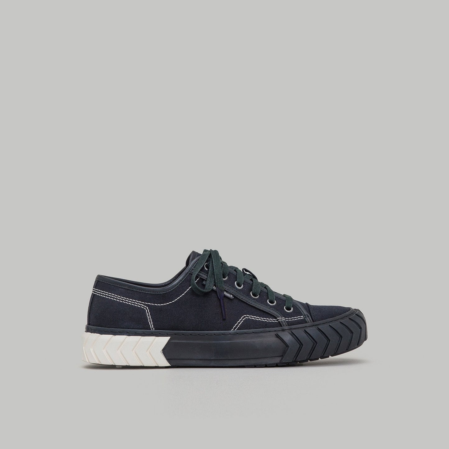 both - TYRES LOW TOP black and white low-top sneaker with durable sole and classic silhouette