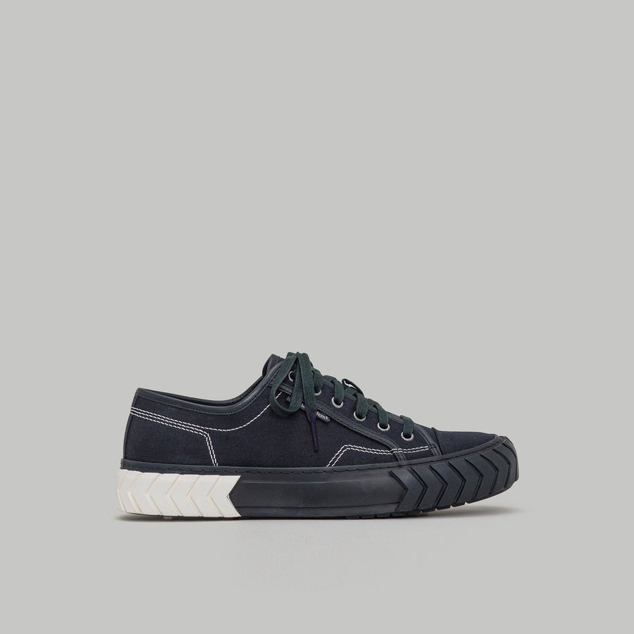 both - TYRES LOW TOP black and white low-top sneaker with durable sole and classic silhouette