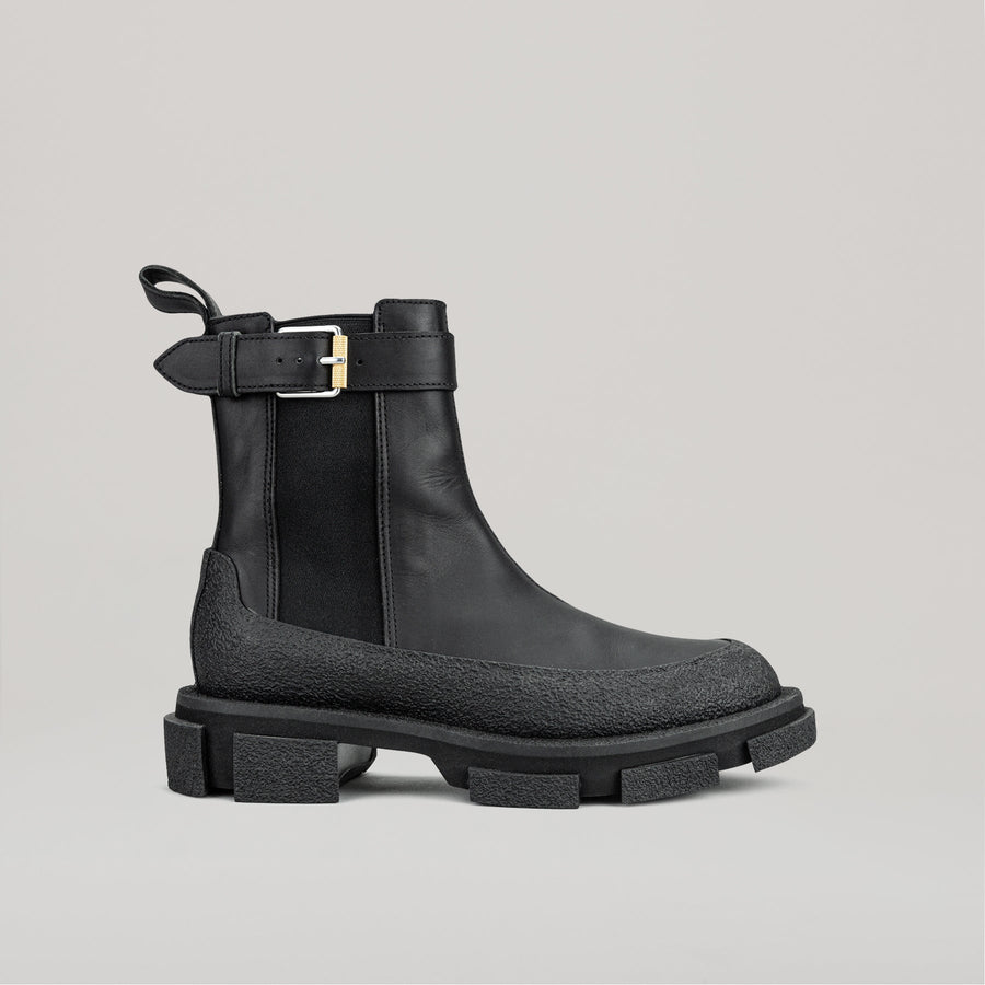 both X DION LEE black GAO Chelsea boot with chunky sole and buckle strap