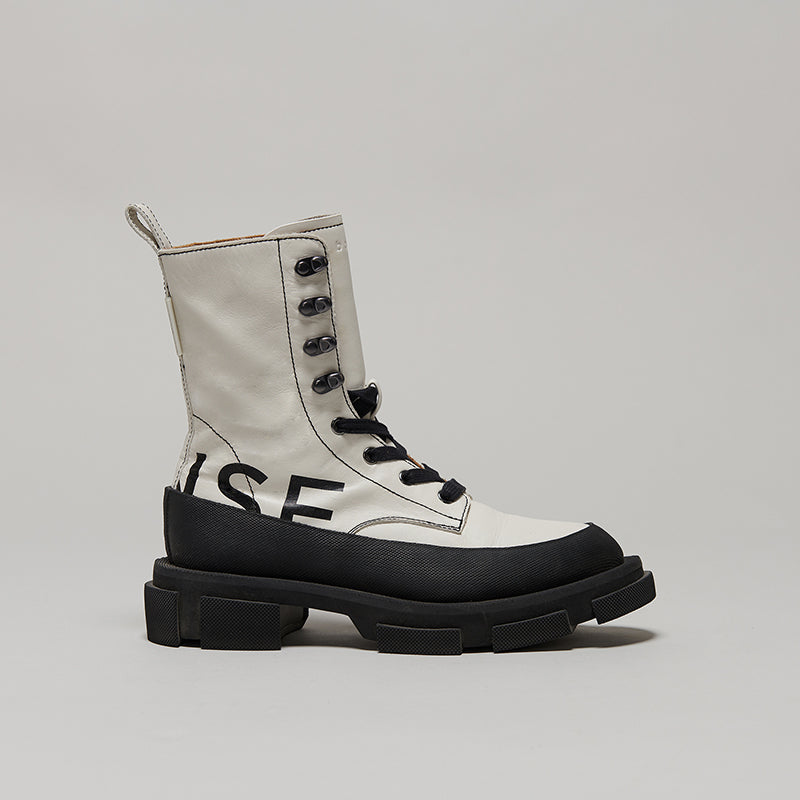 both X MONSE GAO black and white high boots with chunky sole and lace-up design
