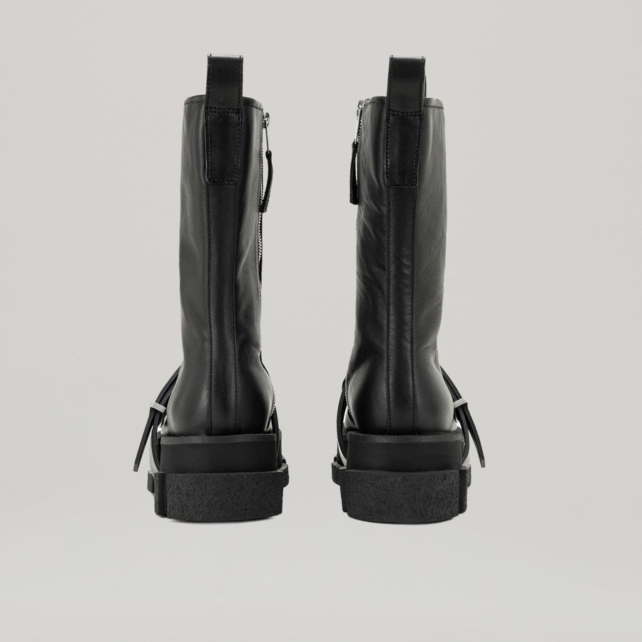Black DION LEE-GAO platform work boots with sturdy sole viewed from rear