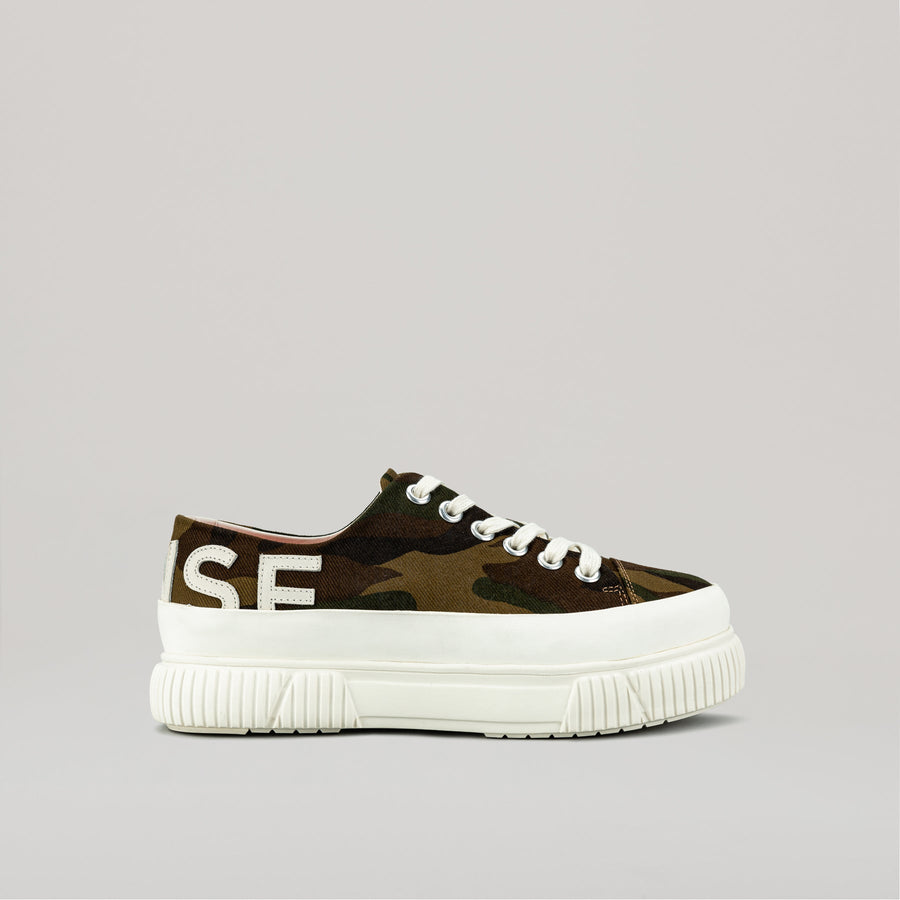 both X MONSE-TYRES Deconstruct Low sneaker in light green with white sole and laces, featuring a modern deconstructed design