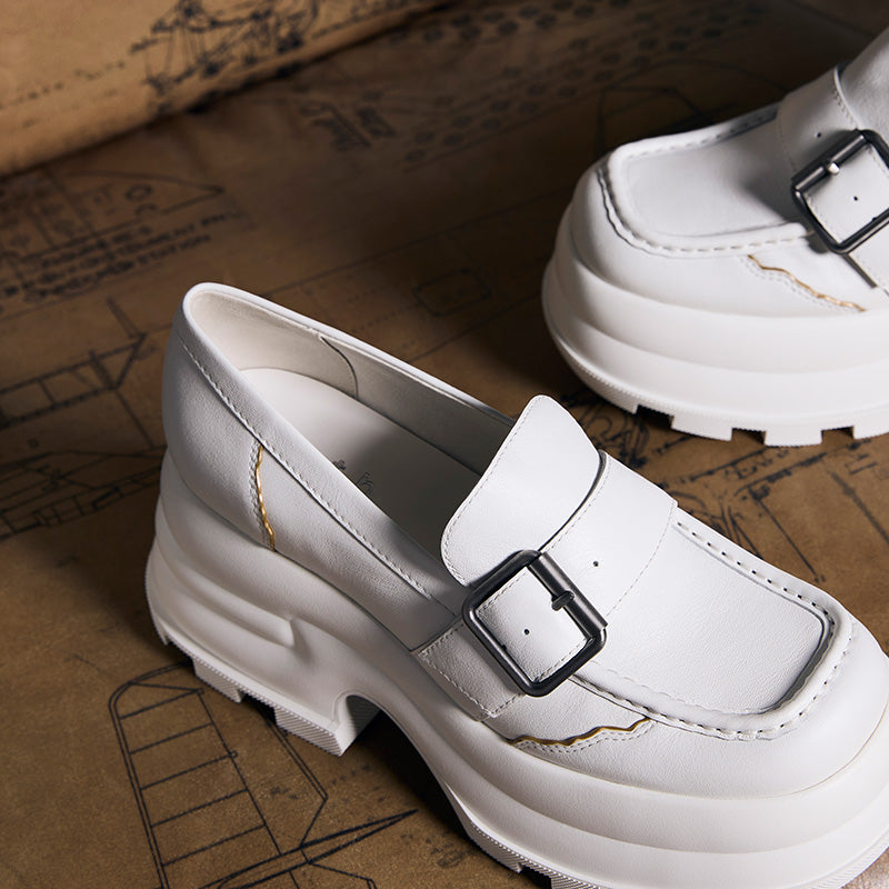 White platform buckled loafers from CHARLES & KEITH with sturdy sole and modern design