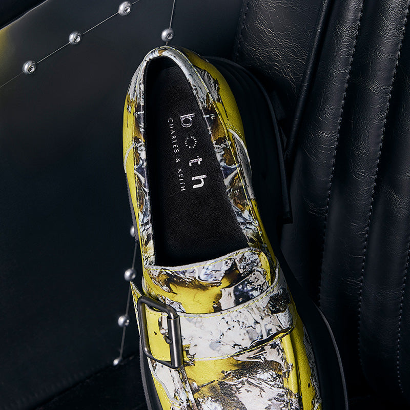 both x CHARLES & KEITH multi-color platform buckled loafer on black leather background