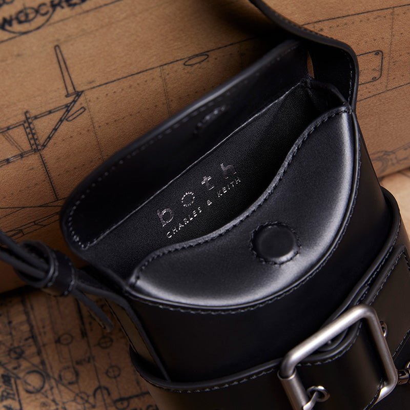 both x CHARLES & KEITH black leather bucket bag with silver buckle and embossed logo inside
